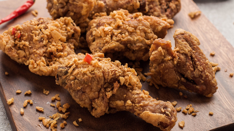 Fried chicken on a wooden board