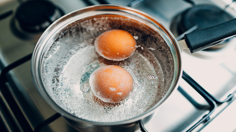 Eggs boiling in a pot