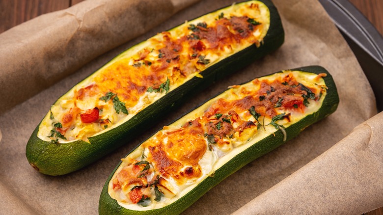 roasted zucchini with cheese tomatoes and herb topping