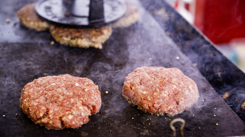 Cooking burgers on flat-top grill