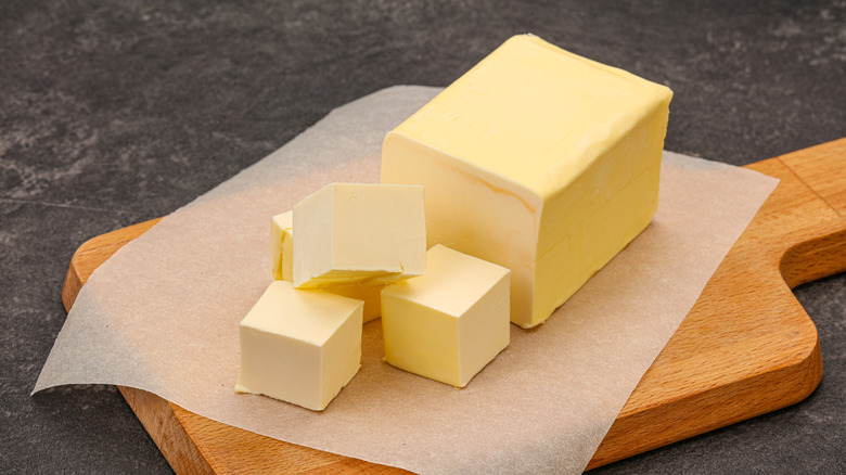 High-quality butter on wooden board