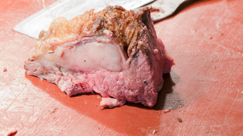 Slab of prime rib on a cutting board