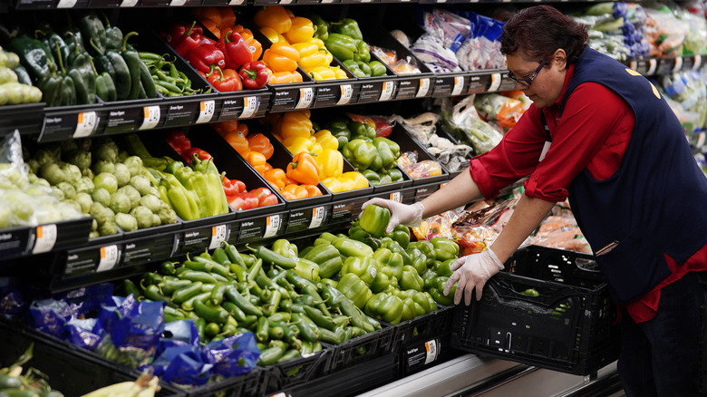 restocking produce at Walmart