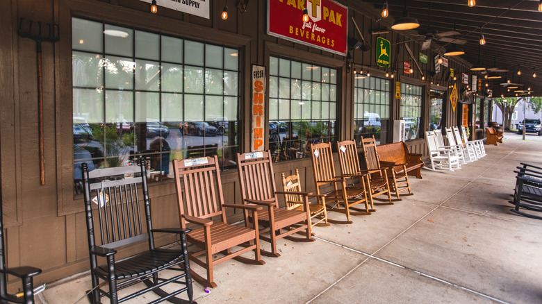 The porch of a Cracker Barrel with rocking chairs