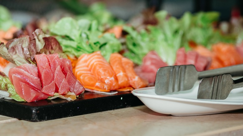 fish sashimi kept at room temperature serving tray in buffet