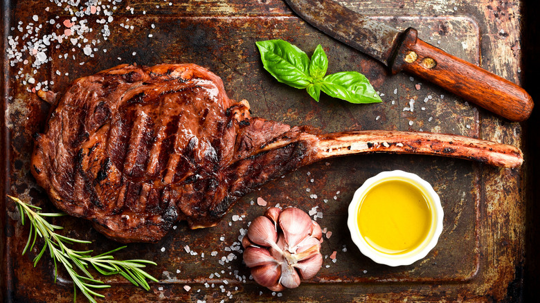 Grilled tomahawk steak on a platter