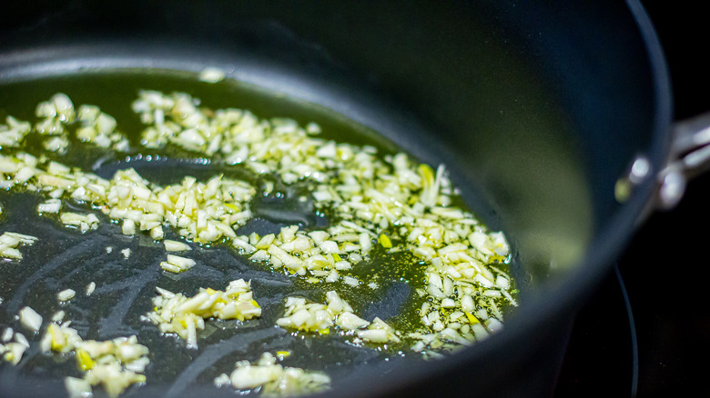 Cooking garlic in pan