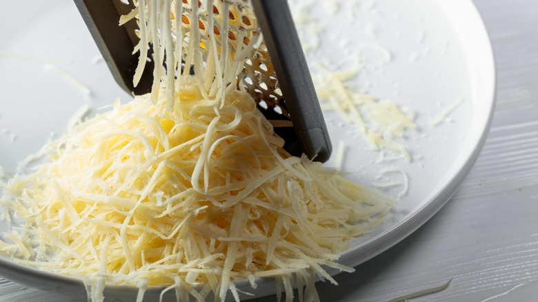 cheese grater on white plate