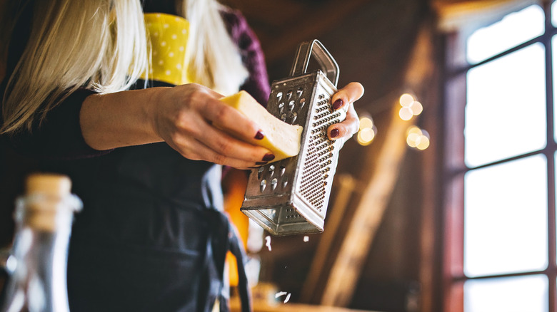 woman grating cheese