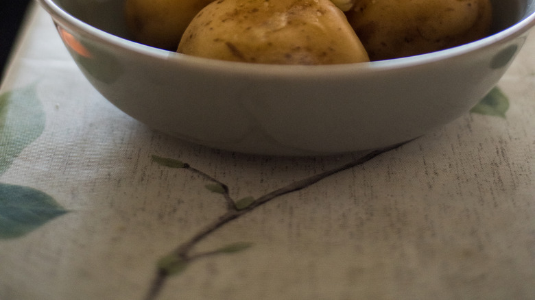 Steaming boiled potatoes in a bowl