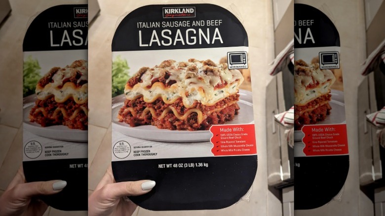 Someone holding Kirkland's Italian Sausage and Beef Lasagna