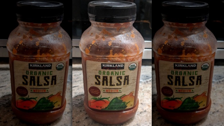 An opened jar of Kirkland Organic Salsa