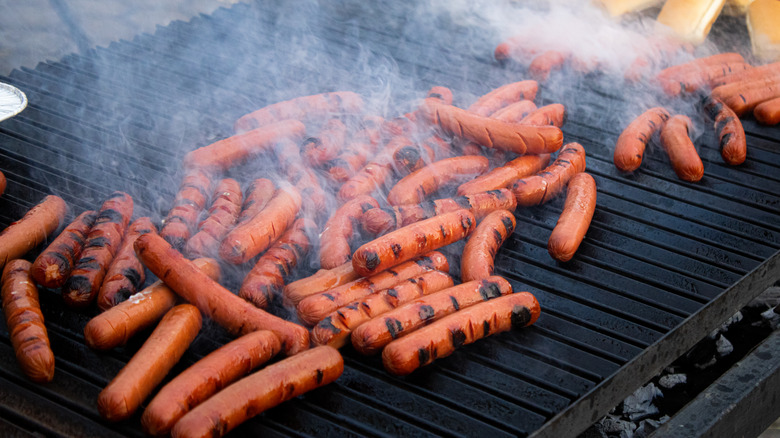 hot dogs on crowded grill