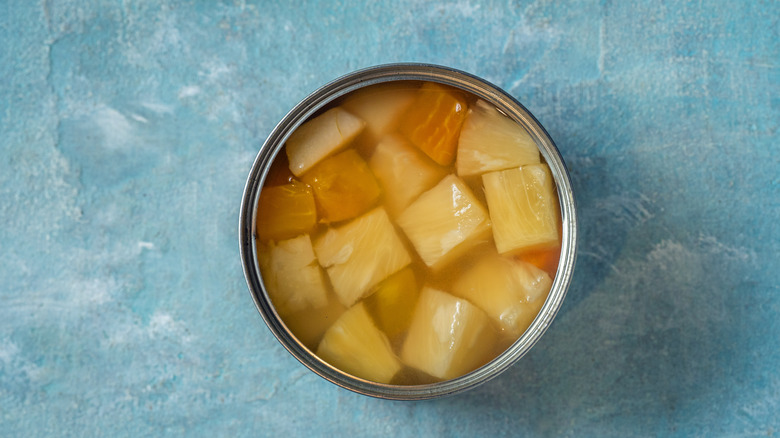 Top down view of an open can of fruit