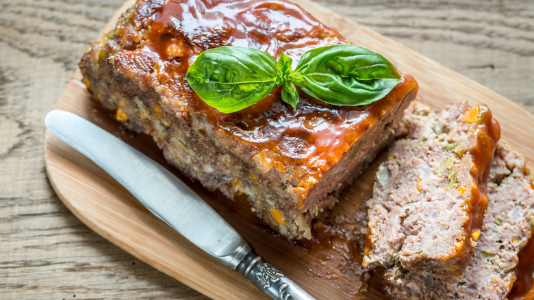 Sliced meatloaf with knife