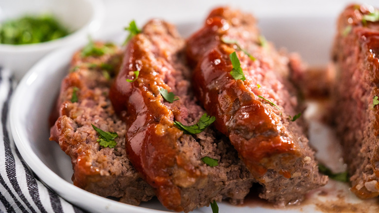 Sliced ketchup-covered meatloaf