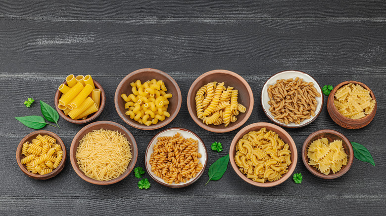 Different pasta shapes in bowls