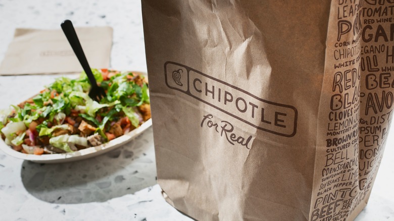 A Chipotle bag and food