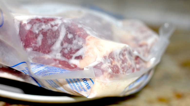 Frozen steak in vacuum packaging