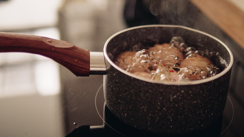 Eggs boiling in a saucepan