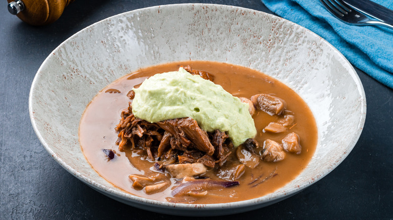 Mushroom soup with meat and mashed potatoes