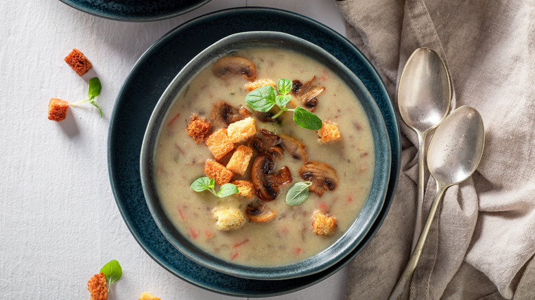 Mushroom soup with croutons in bowl