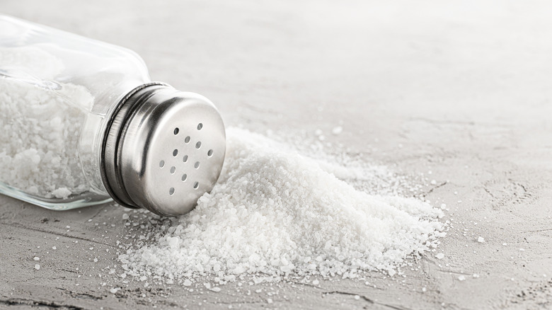 Salt shaker with spilled salt