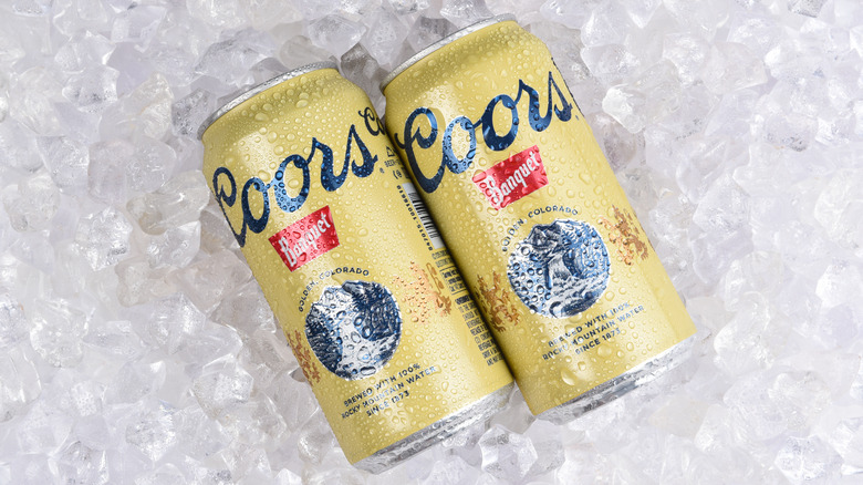 Coors Banquet cans on ice