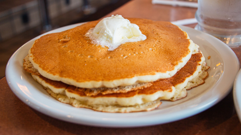 Brown diner pancakes on white plate