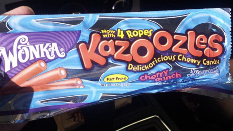 Hand holding pack of Wonka Kazoozles