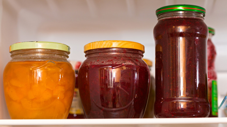 Jars of jelly in fridge