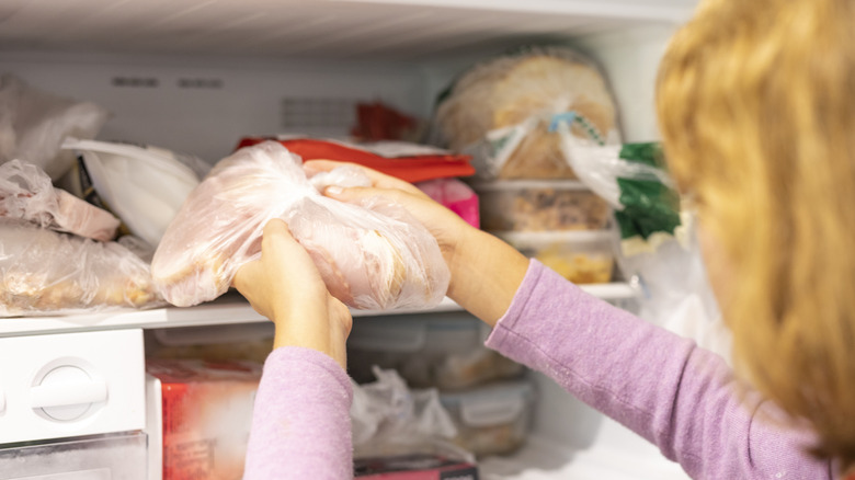 Person getting food out of freezer