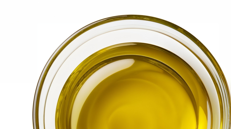 Glass bowl of olive oil