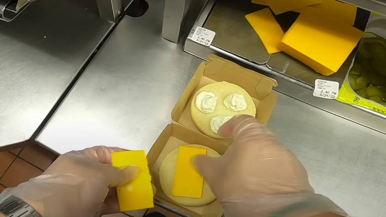 assembling sandwich with cheese