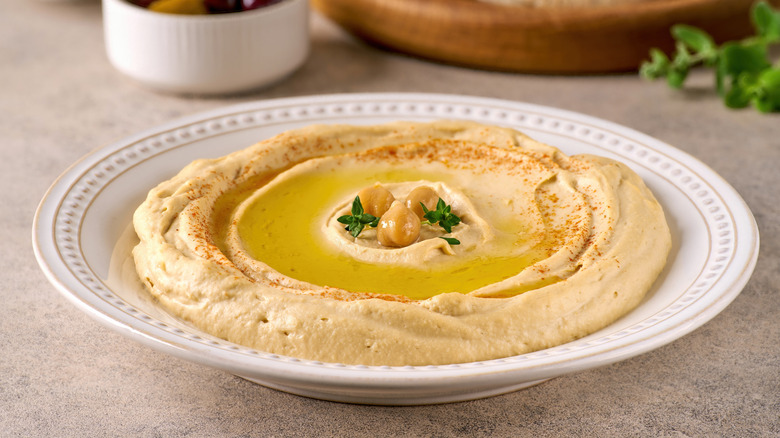 Bowl of hummus on table