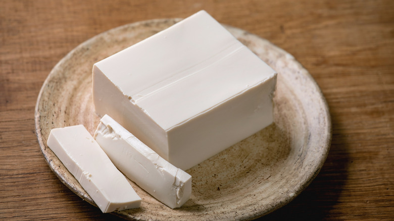 Tofu on small brown plate