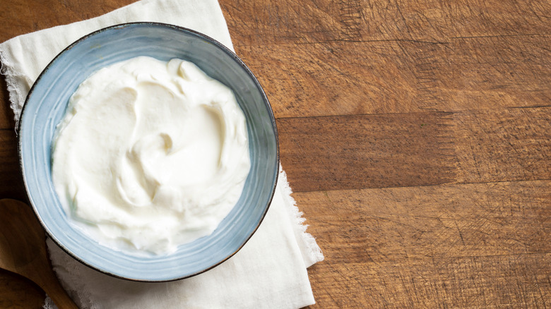 Sour cream in a bowl on a napkin