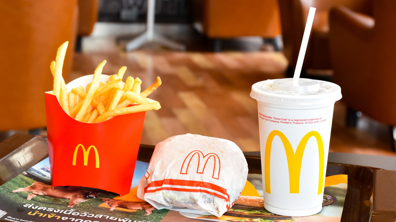 McDonald's combo meal with burger, fries, and soda on tray