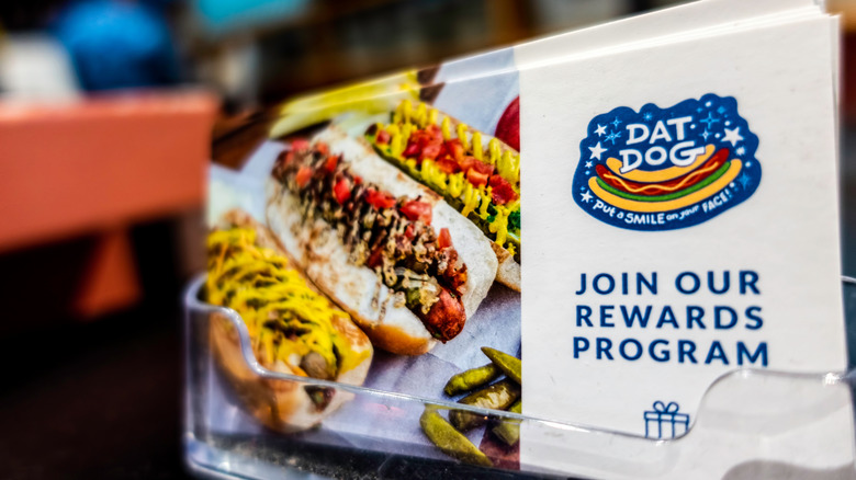 Dat Dog loyalty program flyers with hot dogs