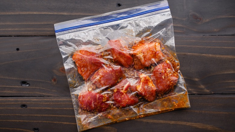 Meat marinating in a plastic bag