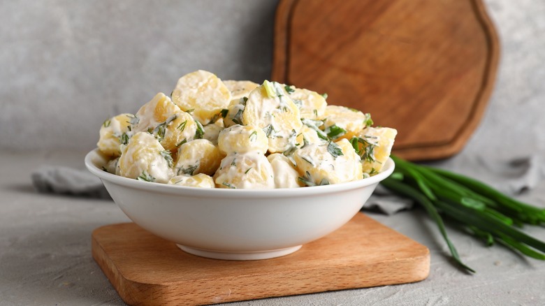 White bowl of potato salad