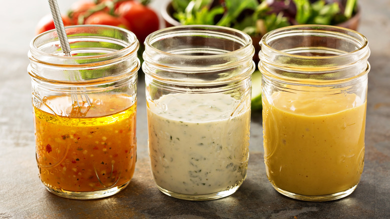 Three jars of salad dressing