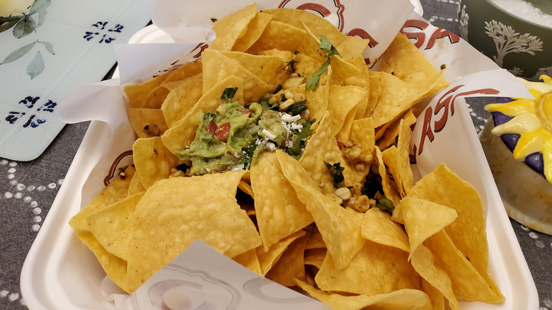 Nachos in a takeout container