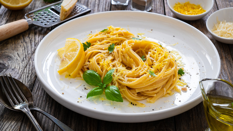 Pasta on plate surrounded by ingredients