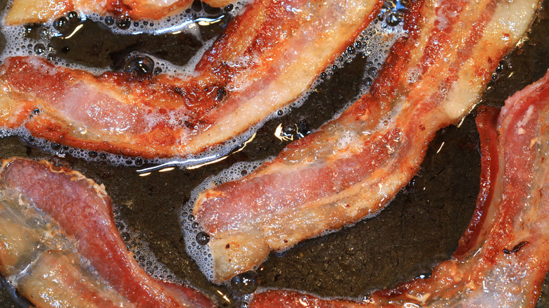 Bacon frying in its fat