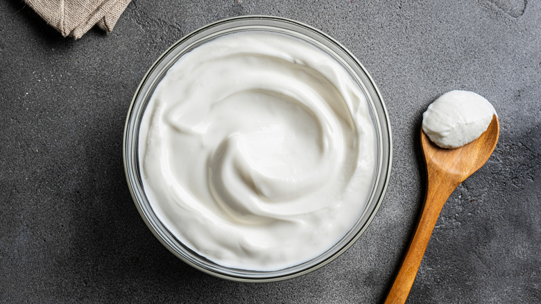 Greek yogurt in bowl with spoon