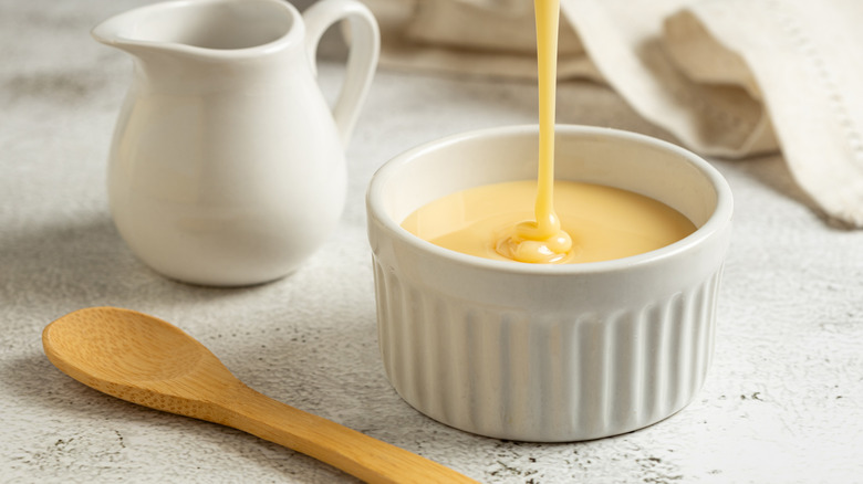 Condensed milk pouring into a bowl