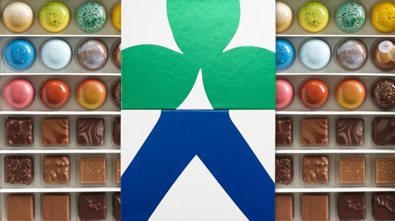 colorful chocolates in an abstract-patterned box