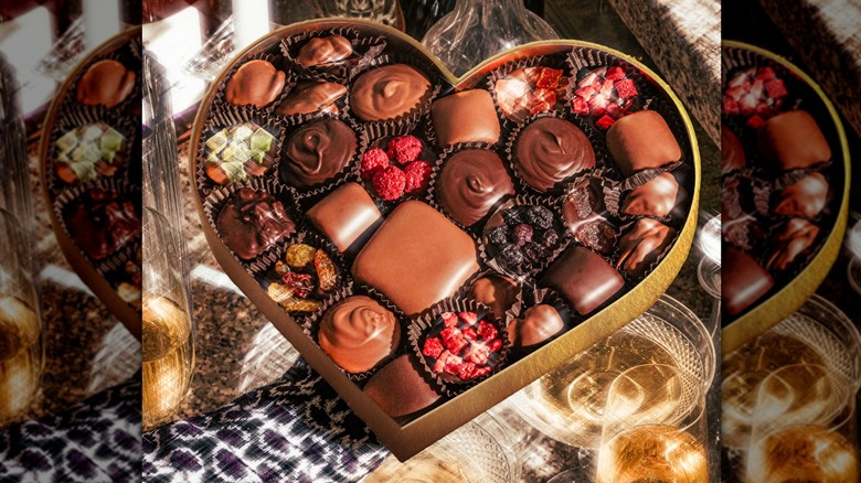 Chocolates and dried fruits come in a heart-shaped box