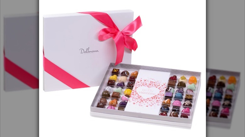 White cardboard box labelled "Dallman" with interior showing colorful chocolate selection